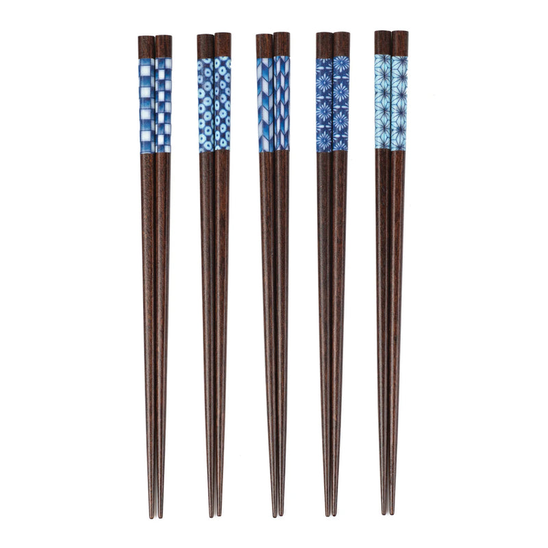 Set of five wooden chopsticks with blue patterned ends on a white background