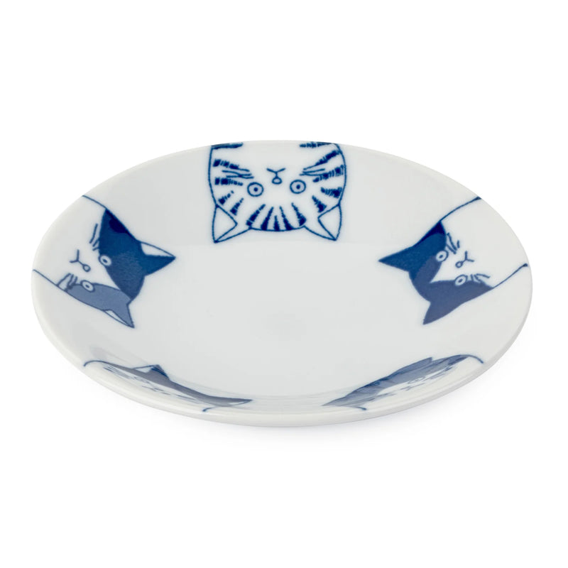 Small white plate with blue cat illustrations on a white background