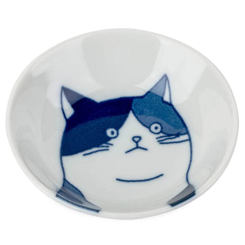 Small white dish with a blue and white cat design on a white background