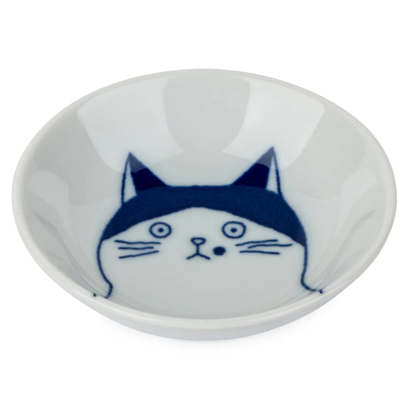 Small white dish with a blue cat face design on a white background