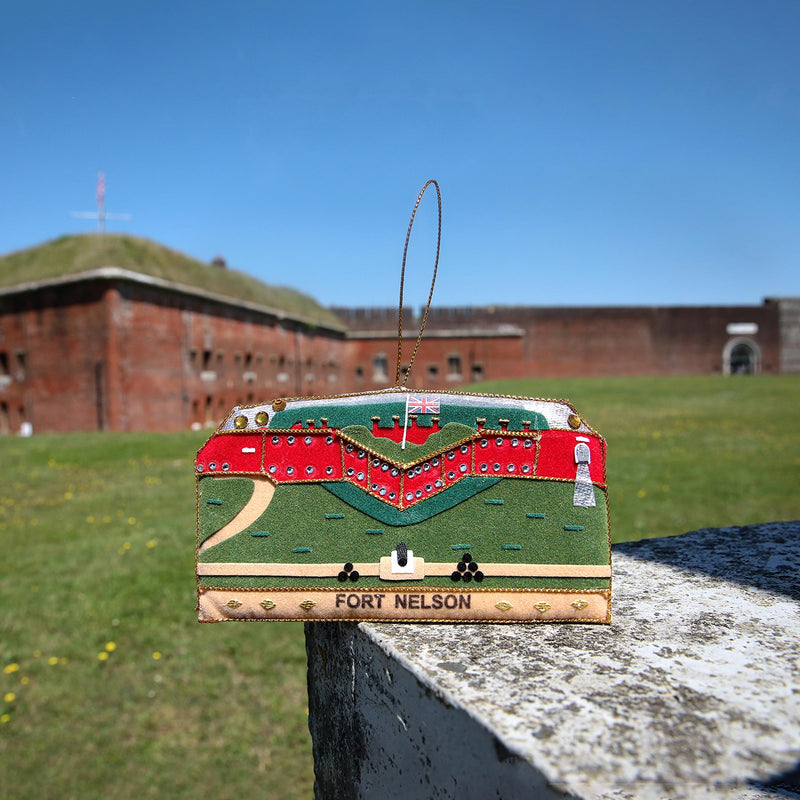 Fort Nelson Textile Decorative Hanging in front of Fort Nelson