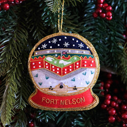 Fort Nelson Building in a Snow Globe hanging decoration on Christmas tree background