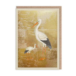 Card with illustration of two storks on a gold background