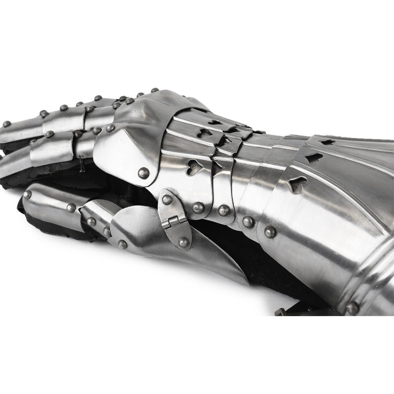 Close-up of a metallic gauntlet on a white background