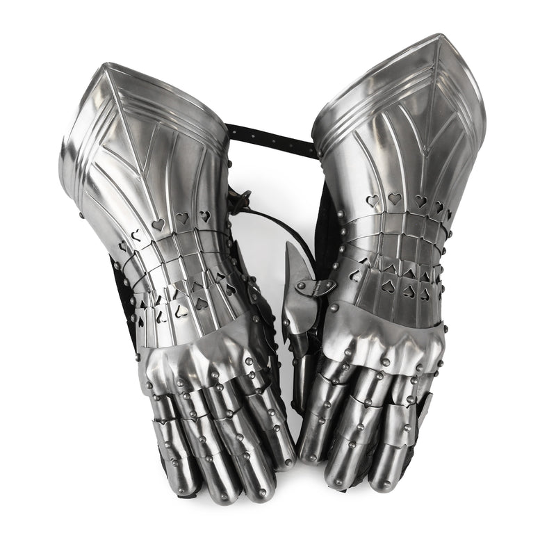 Pair of metallic gauntlets on a white background, viewed from above