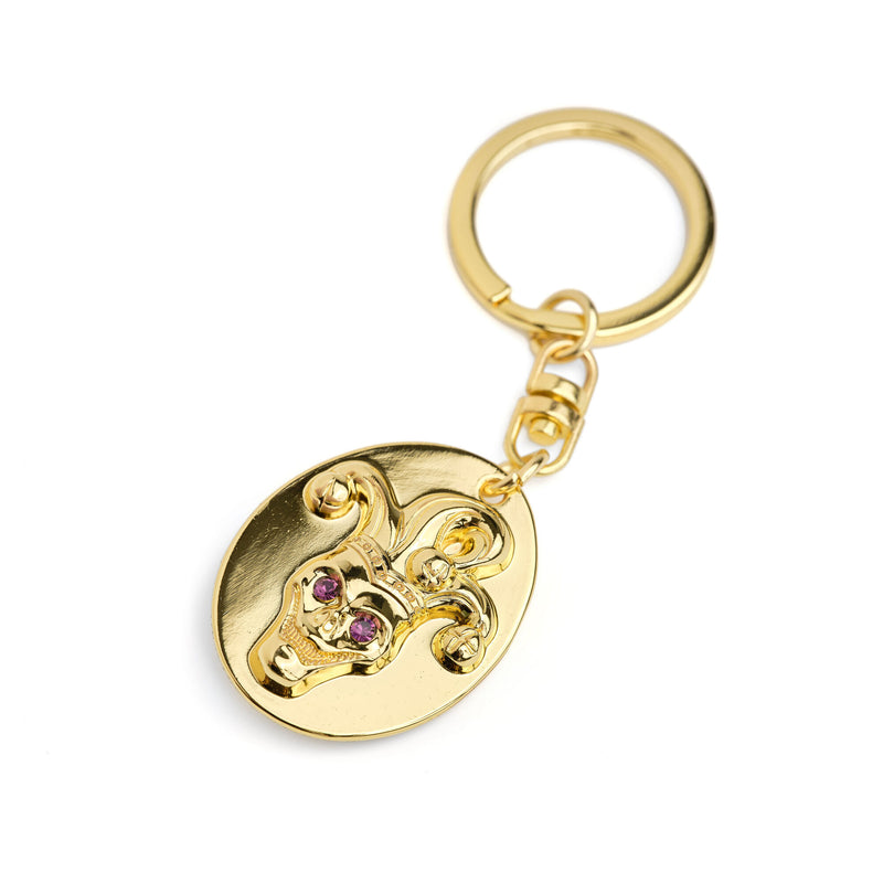 the joker gold coloured keychain 