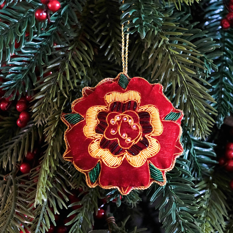 Red velvet Tudor Rose hanging decoration on christmas tree