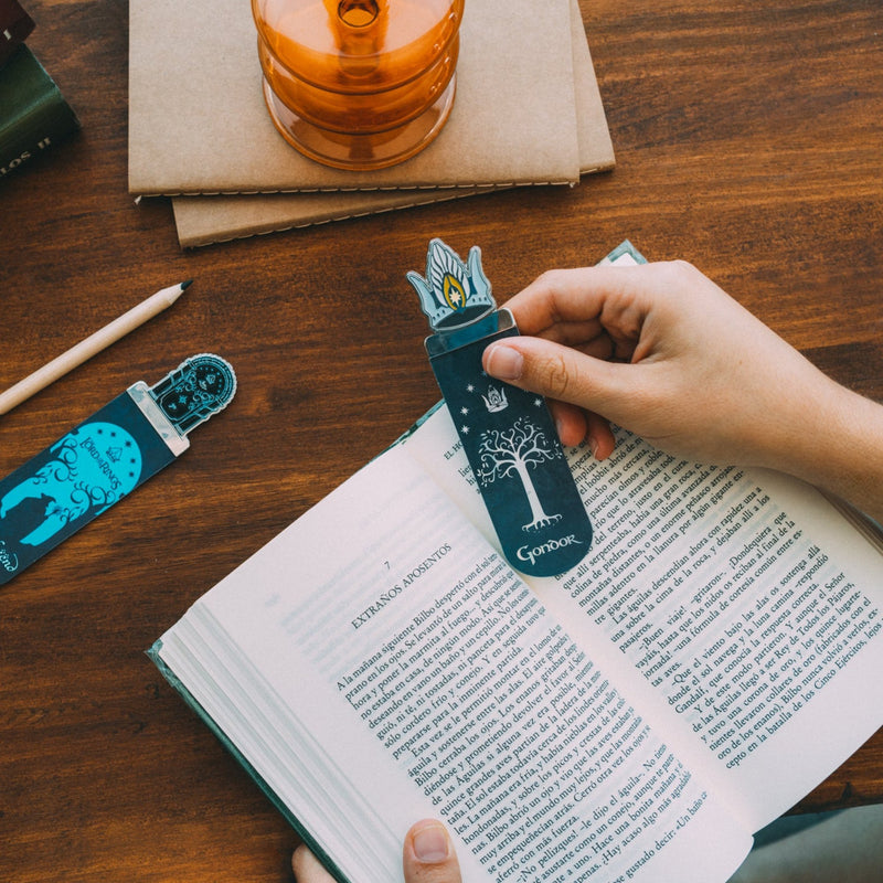 lord of the rings bookmark being placed inside a book