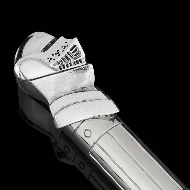 pen cap shaped like henry viii's helmet close up on black background