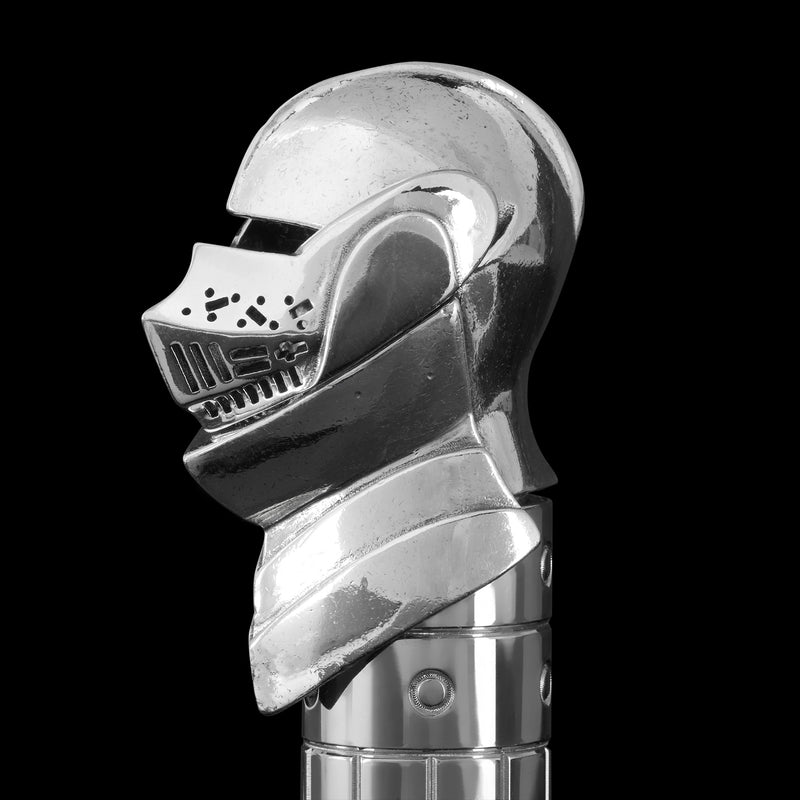 Chrome helmet-shapedpen cap on a black background