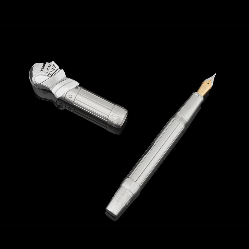 Fountain pen with a metallic finish on a black background