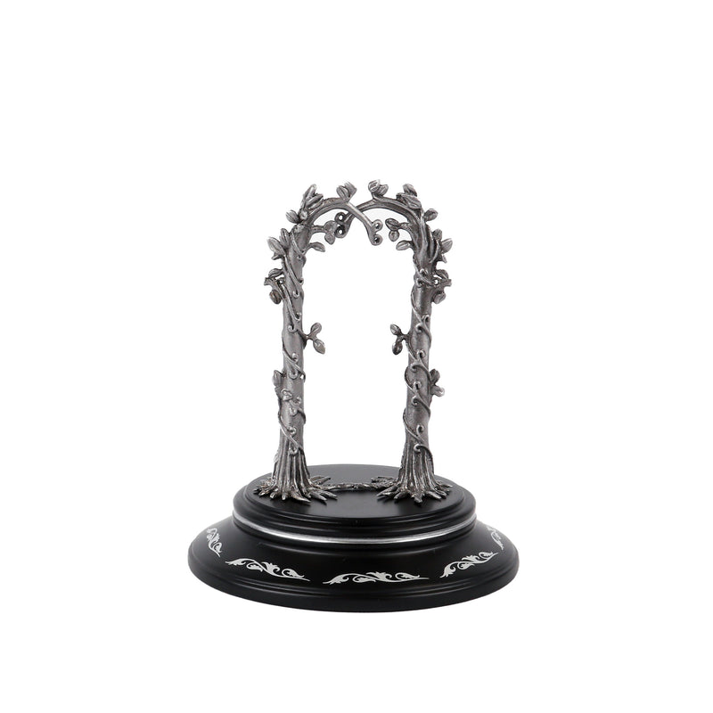 Decorative metal arch on a black base with white detailing against a white background