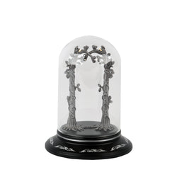 Decorative arch with trees inside a glass dome on a black base