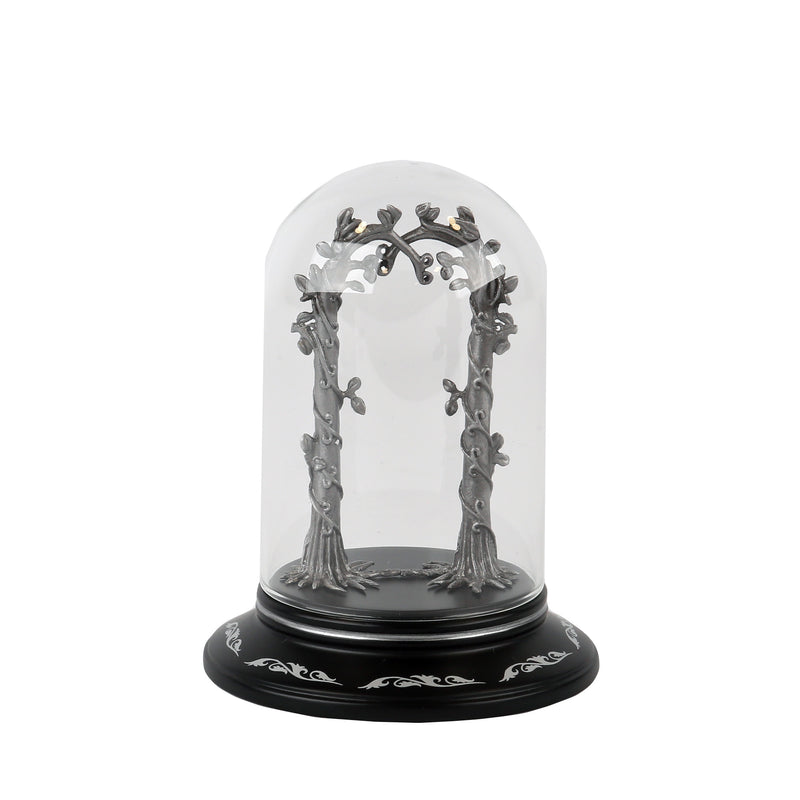 Decorative arch with trees inside a glass dome on a black base