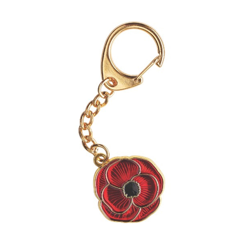 Red poppy flower keychain with gold chain on a white background