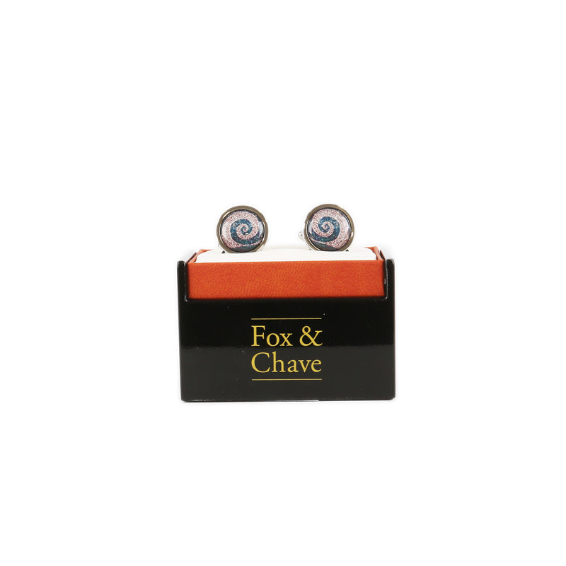 front view of roman mosaic spiral cufflinks in black and orange branded presentation box