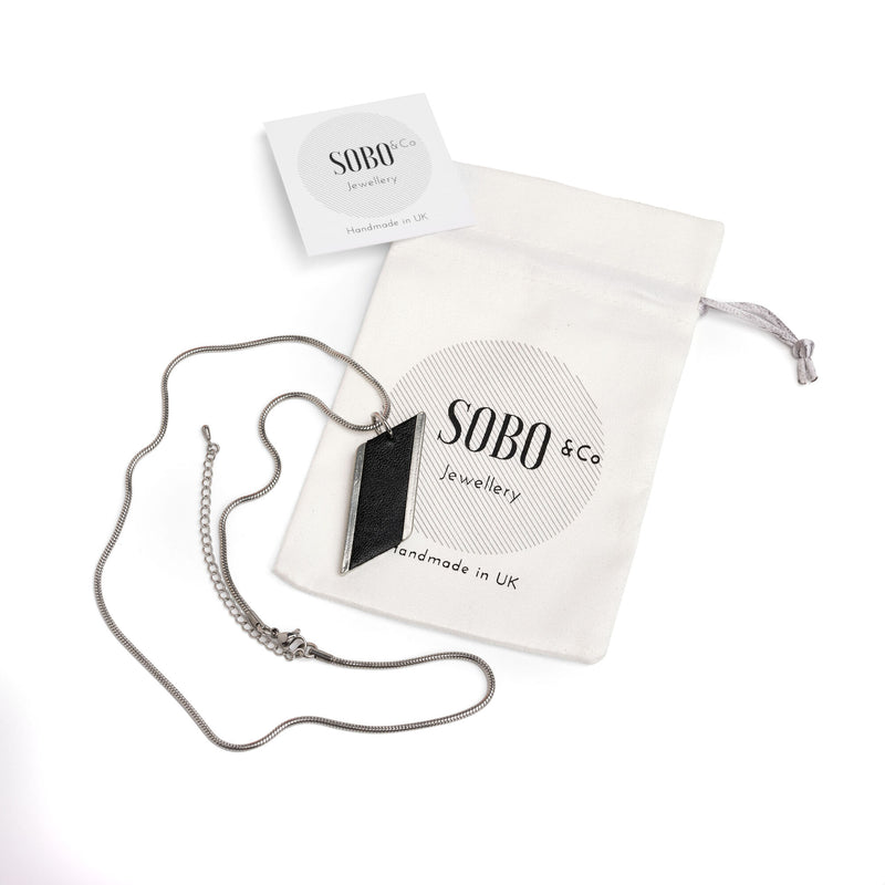 diamond feature snake chain necklace with a black leather inlay with packaging pouch and card
