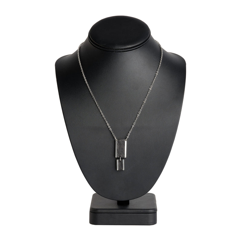 double rectange feature necklace with a black leather inlay on black display stand