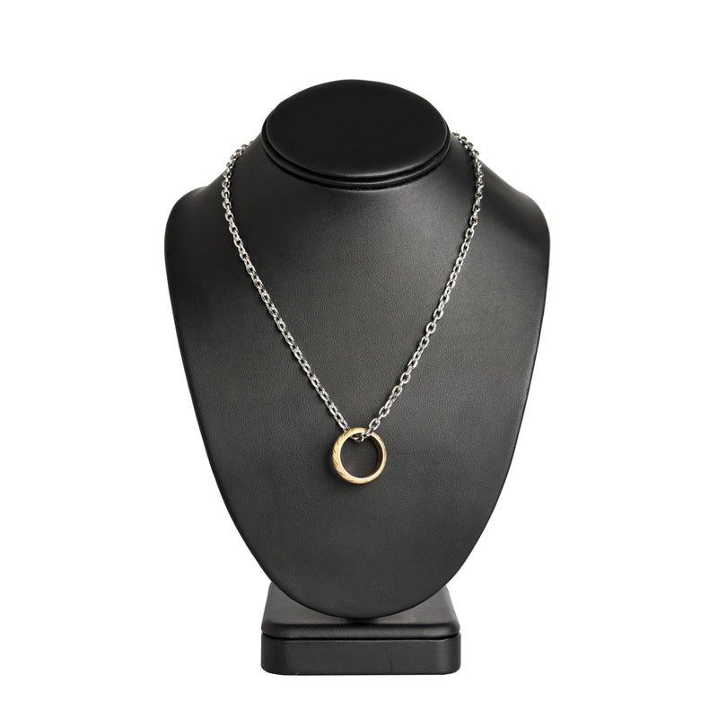 the one ring necklace on a black display stand
