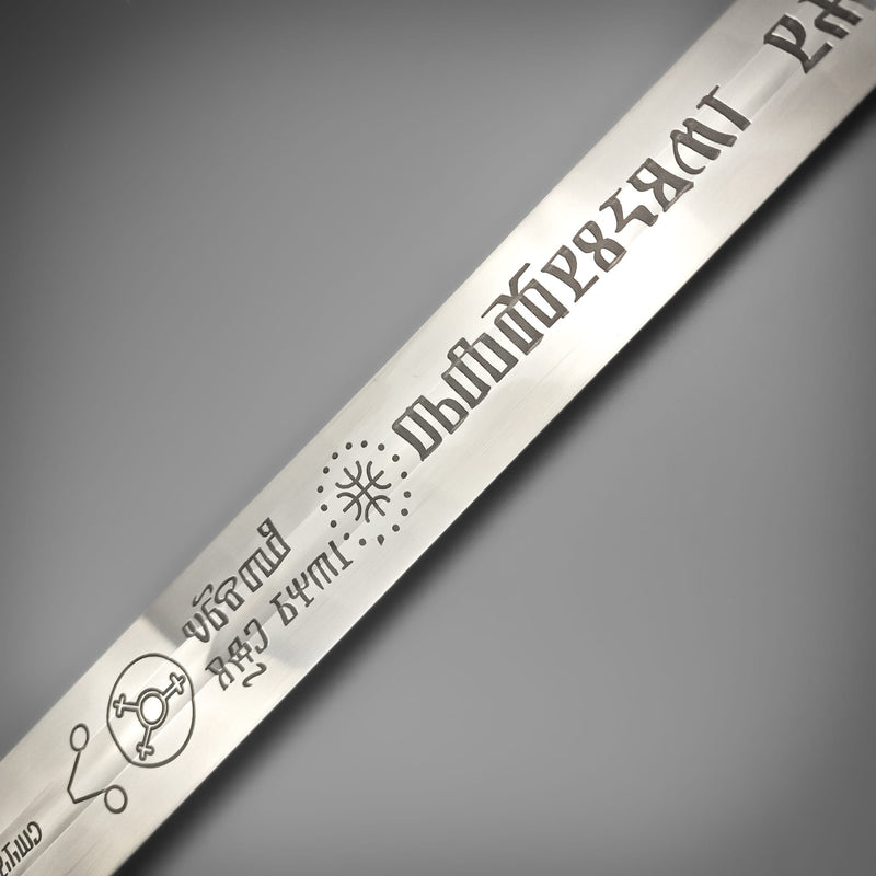 Metal strip with engraved text and symbols on a gray background