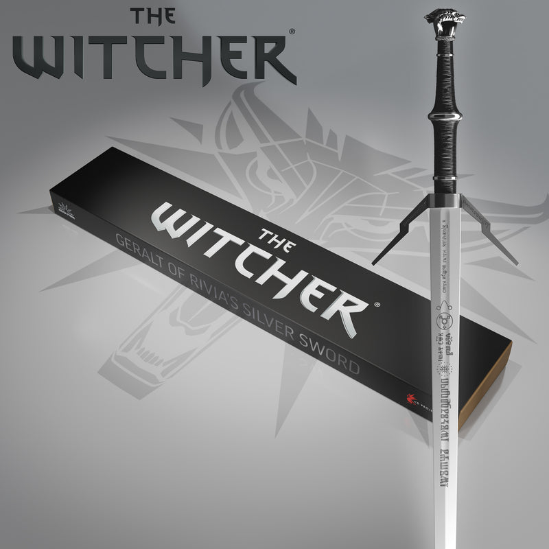 Sword and packaging with 'The Witcher' branding on a gray background