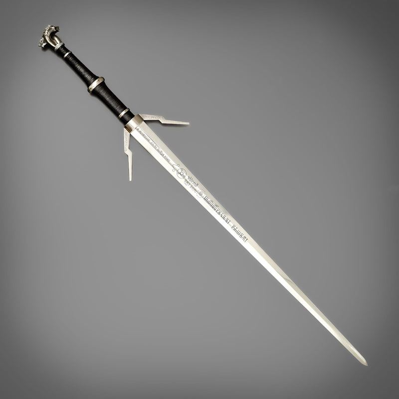 Decorative sword with a black handle on a gray background