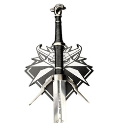Decorative sword with intricate design on a white background