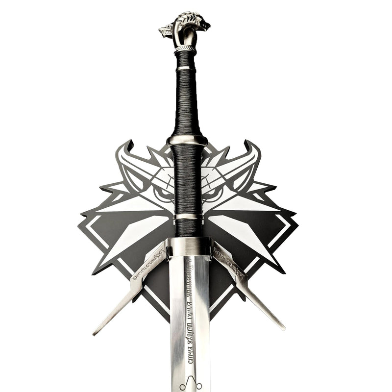Decorative sword with intricate design on a white background