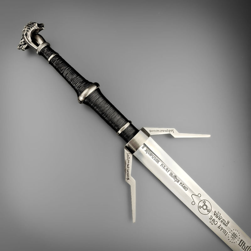Decorative sword with a detailed handle on a gray background
