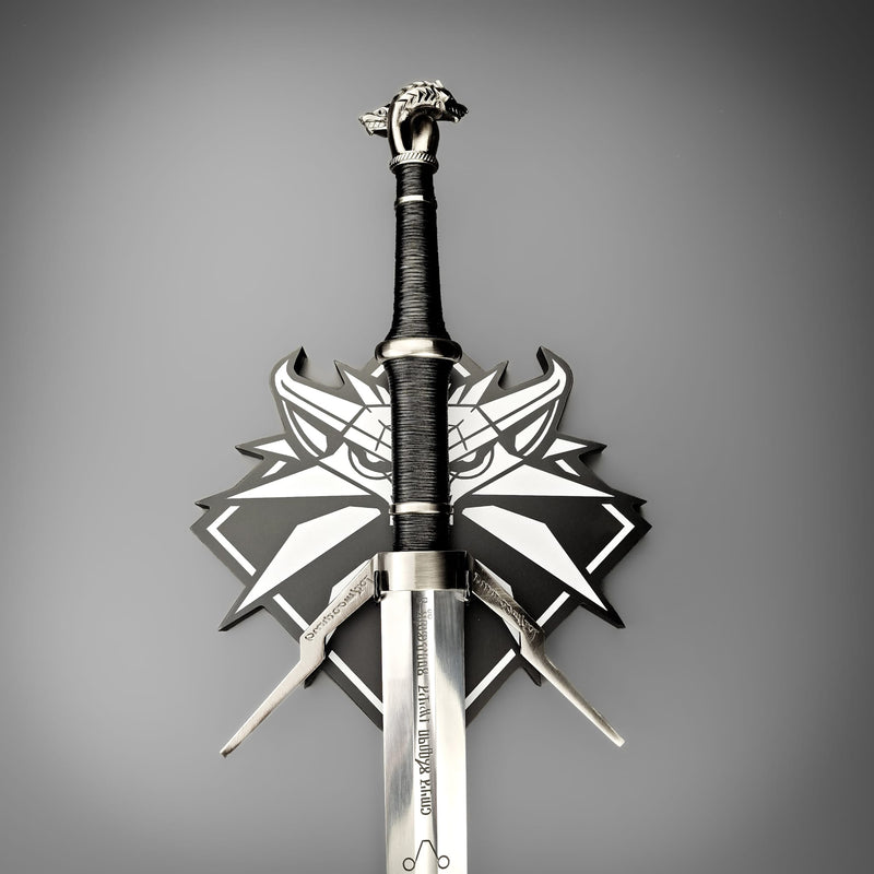 Decorative sword with a detailed hilt on a gray background