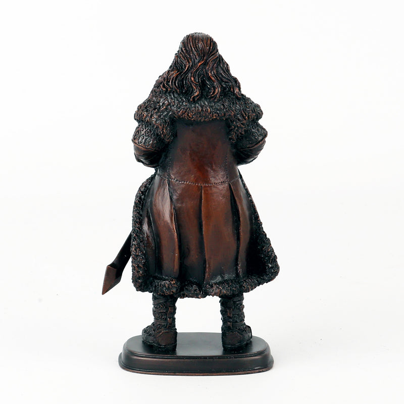 Bronze statue of Thorin Oakenshield in a detailed costume on a white background from the back