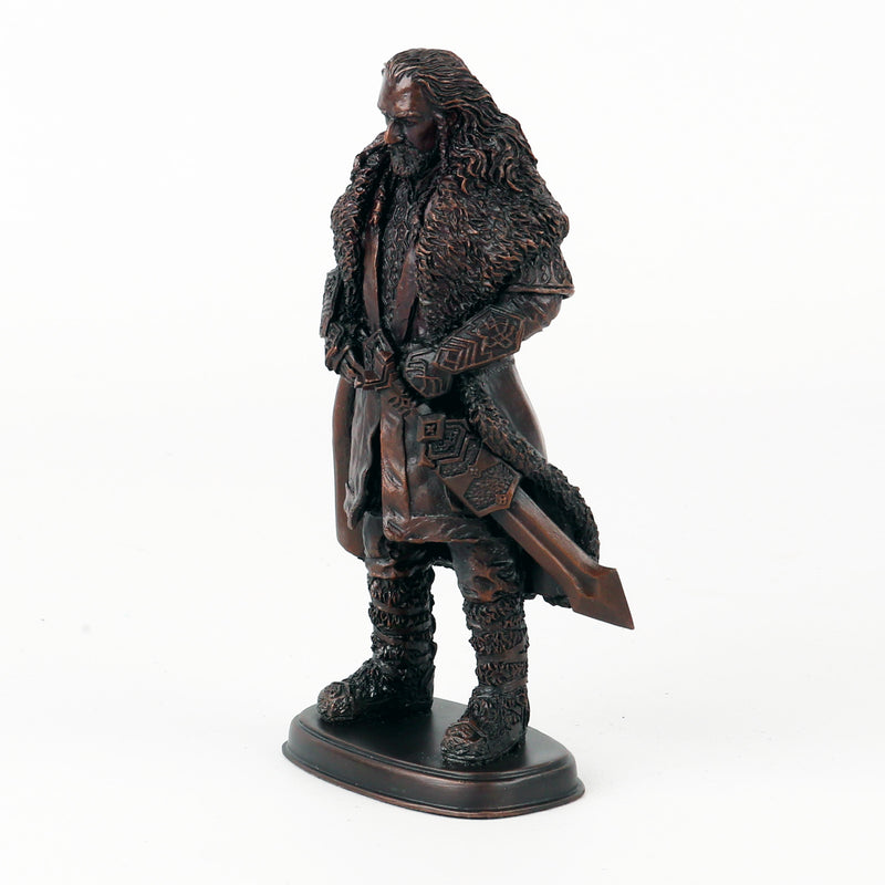 Bronze statue of Thorin Oakenshield in a detailed costume on a white background from the left
