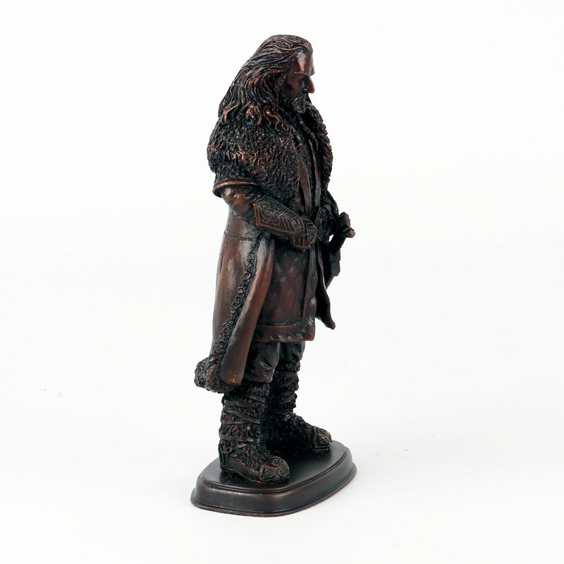 Bronze statue of Thorin Oakenshield in a detailed costume on a white background from the right