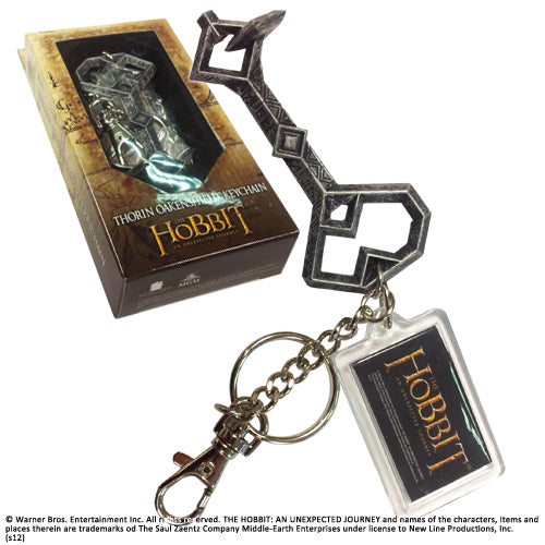 Thorin's key keyring full view next to branded packaging