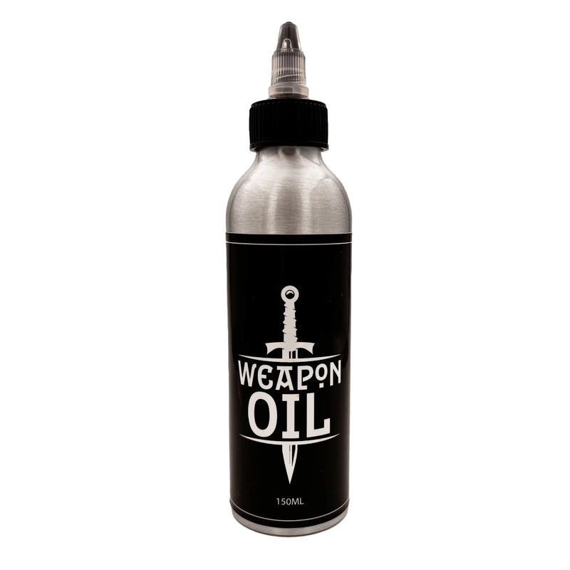 metal weapon oil bottle with a black label