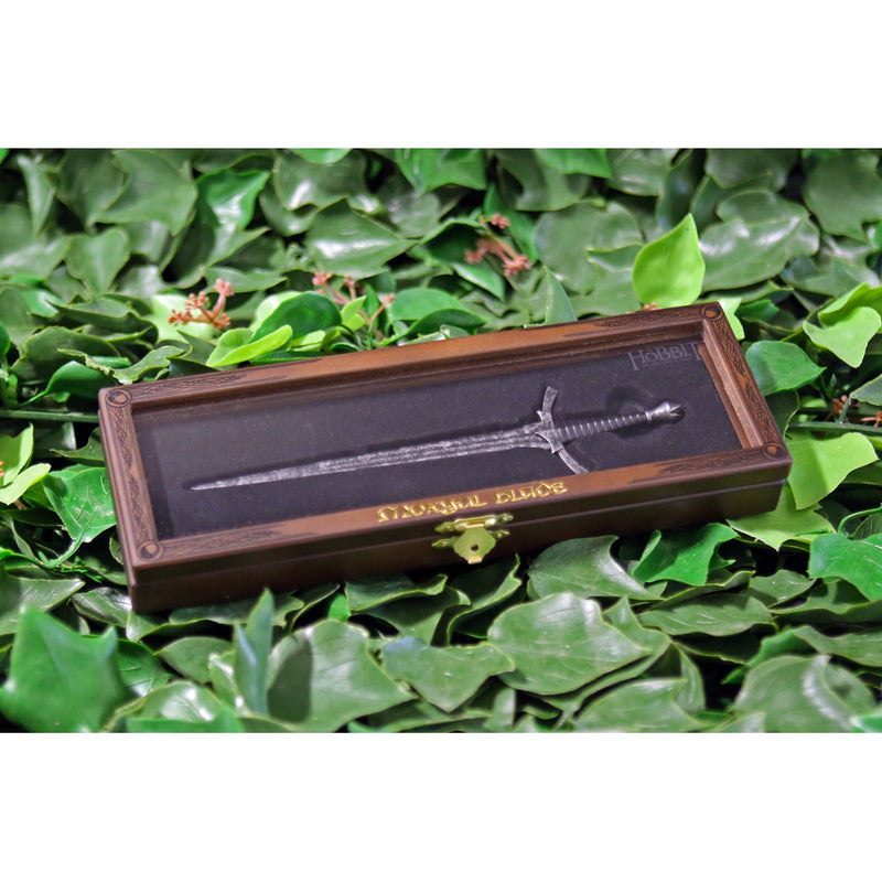 Morgul blade replica letter opener in wooden display case on a bed of ivy